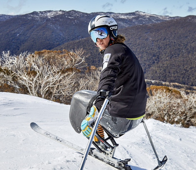 Adaptive skier on snowy slope at Thredbo, Kosciuszko National Park, Australia