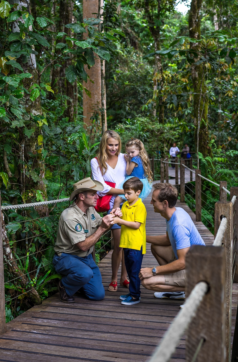 Family exploring the Skyrail Rainforest Cableway in QLD with a ranger guide