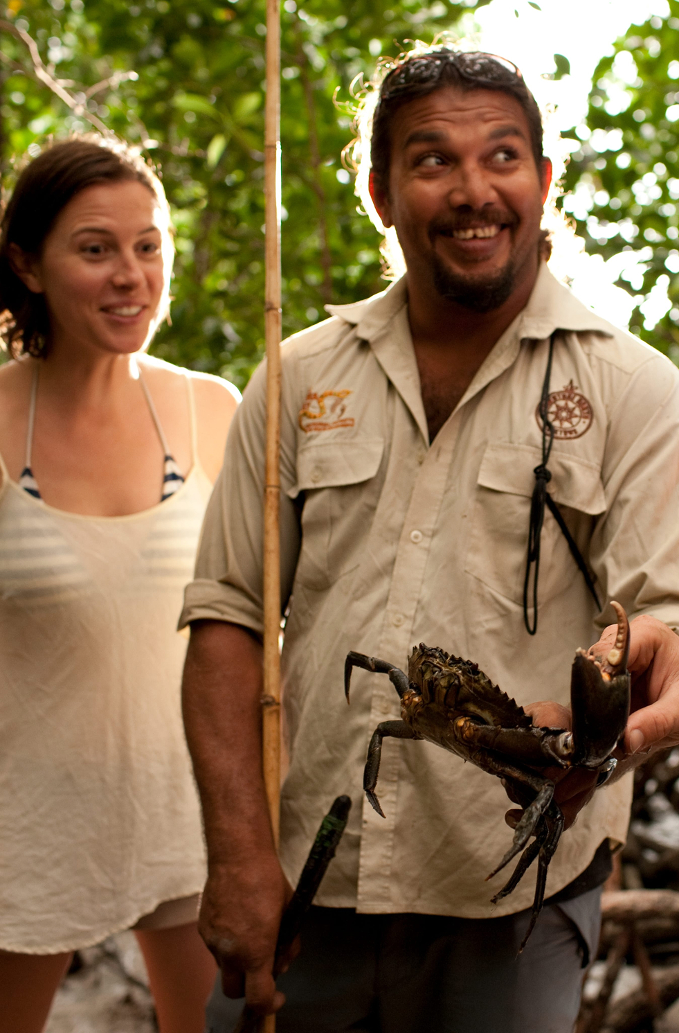 Guide and guest spear fishing for mud crabs, Walkabout Cultural Adventures, Queensland