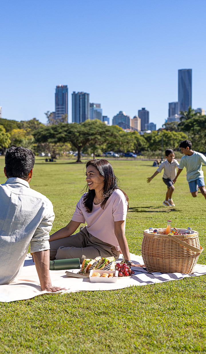 Couple in park with city in the backround