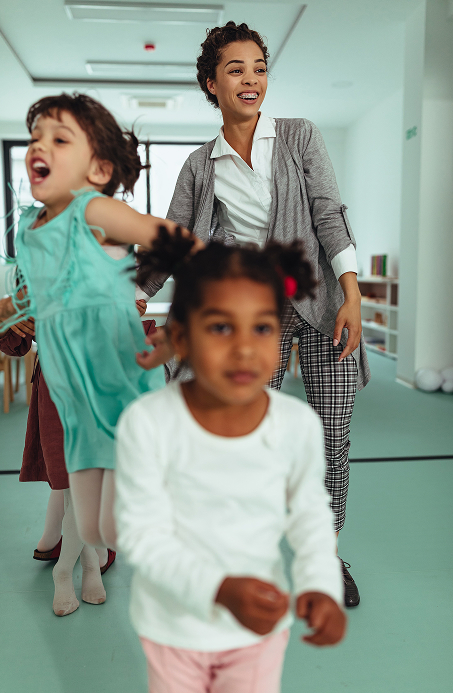 Early childcare worker with children
