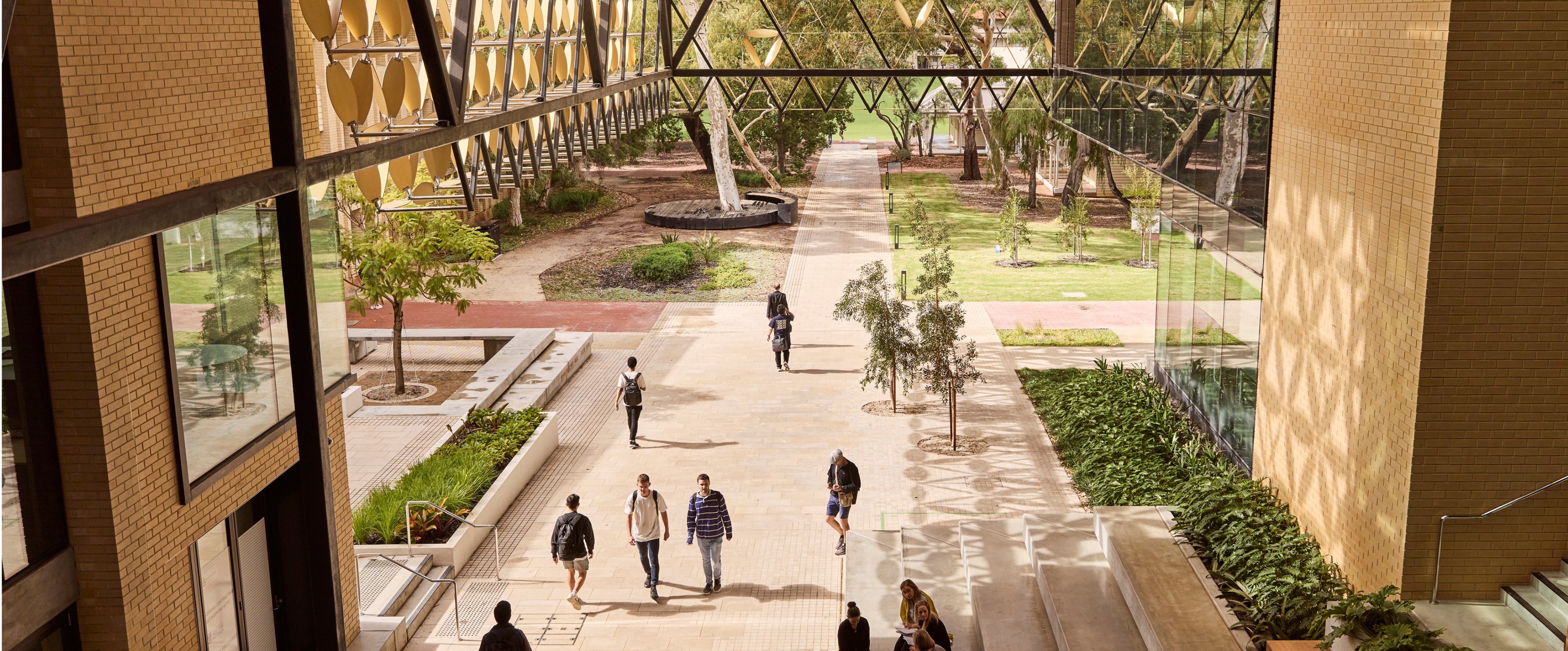 Exterior shot of the University of Western Australia campus with students walking around