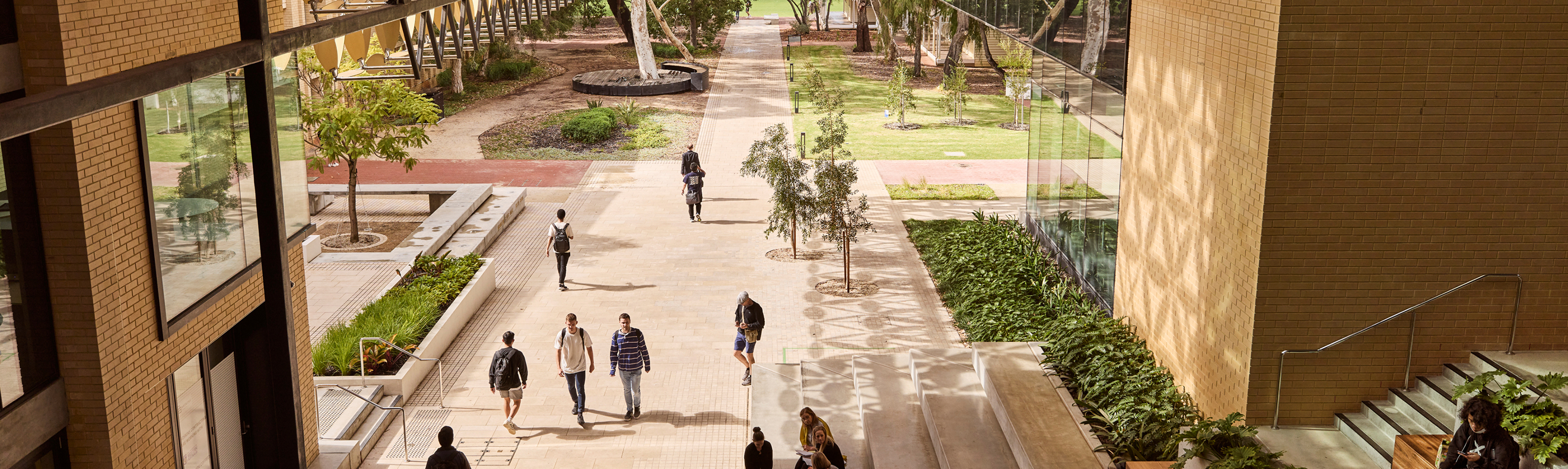 Exterior shot of the University of Western Australia campus with students walking around