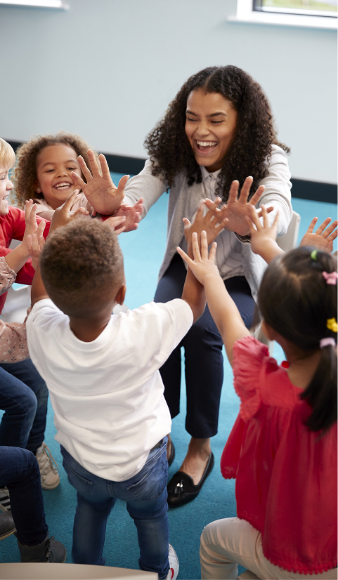 Infant school children in a circle in the classroom