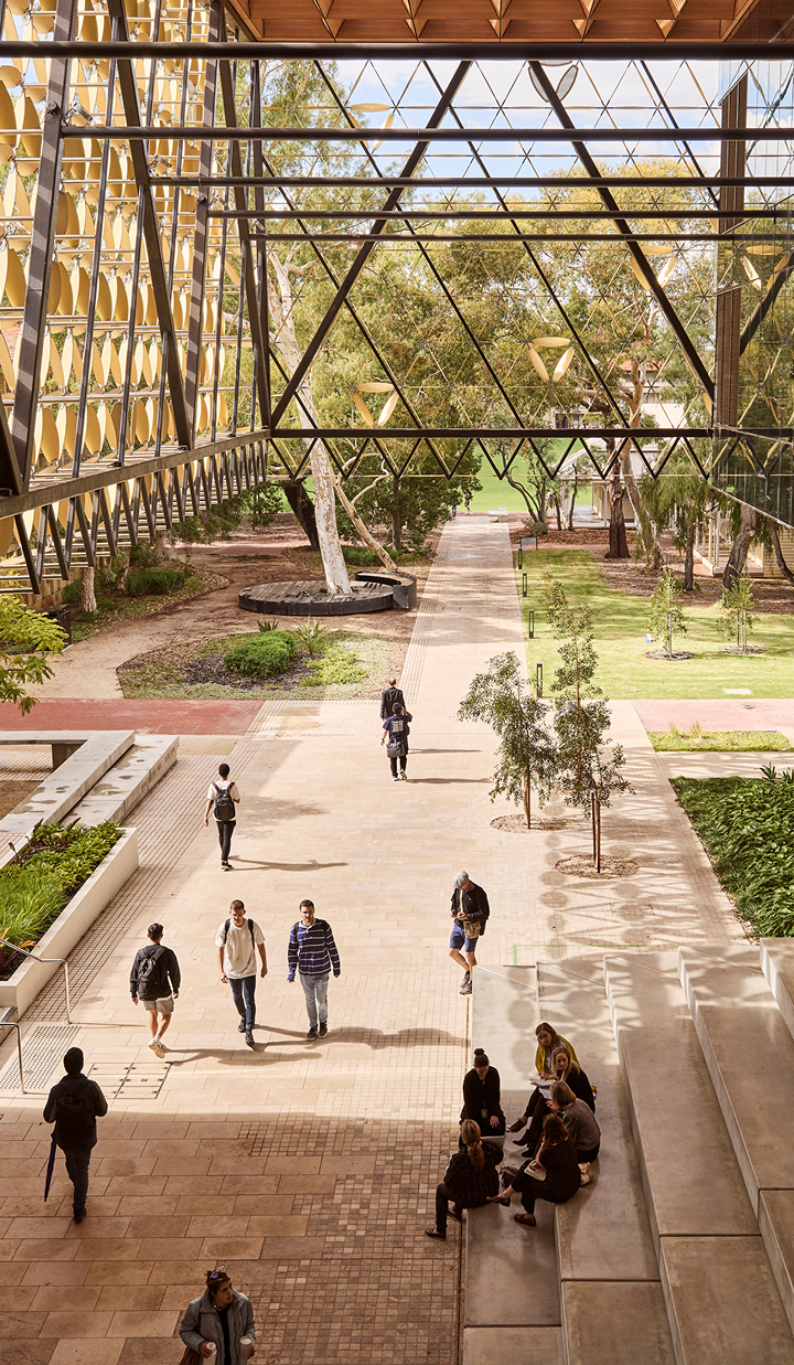 Exterior shot of the University of Western Australia campus with students walking around