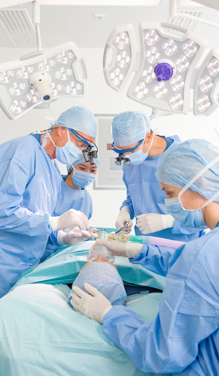 a-confident-team-of-surgeons-performing-an-operation