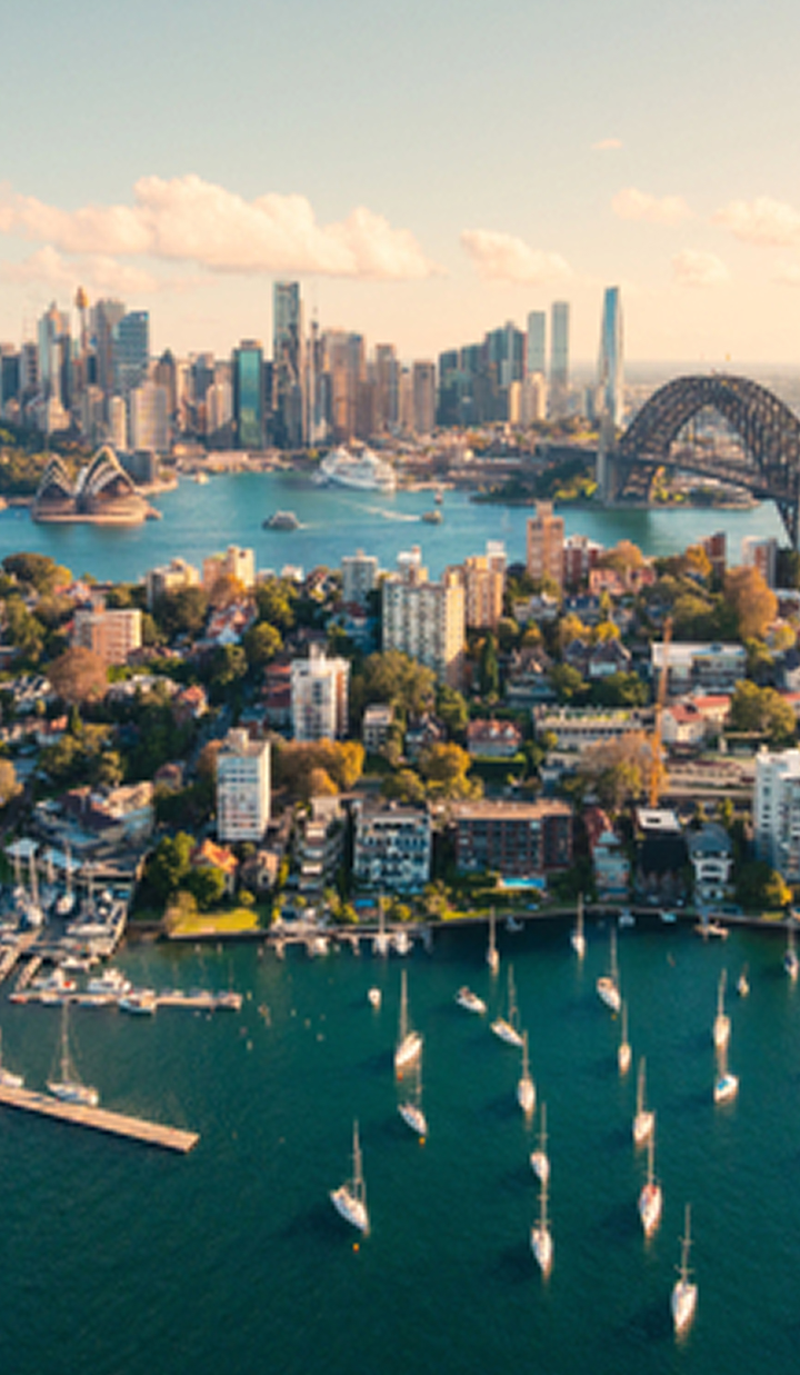 aerial-view-sydney-harbour-with-opera-house-and-bridge-at-sunset