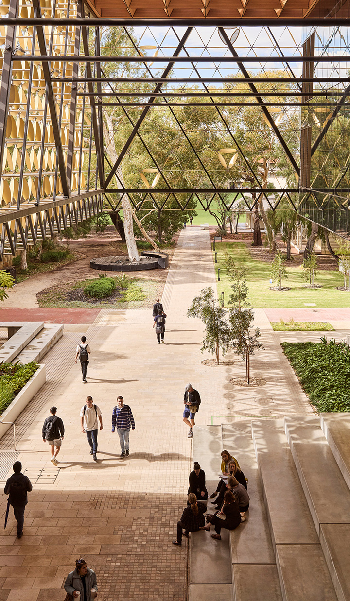 Exterior shot of the University of Western Australia campus with students walking around