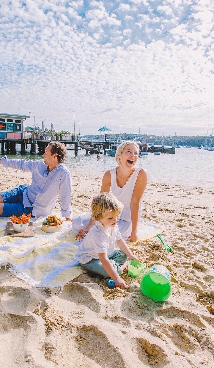 Happy family relaxing on a beach 