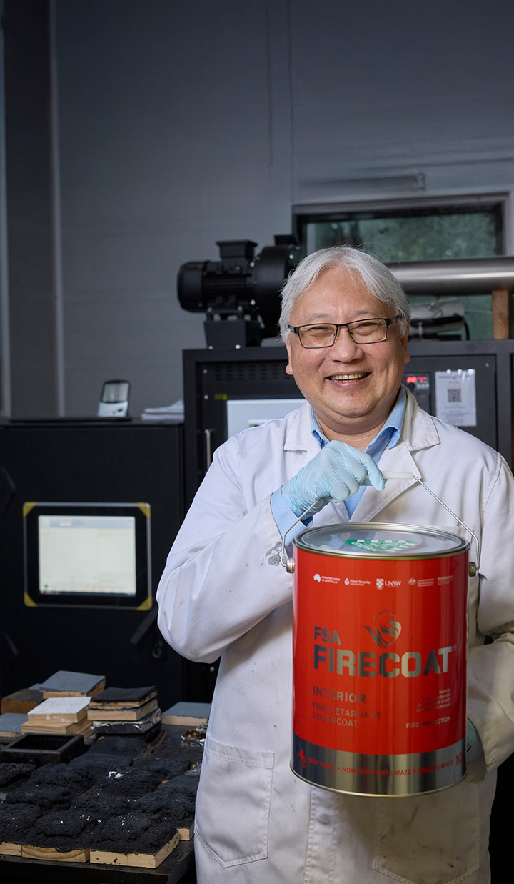 Guan Yeoh holding a bucket of FSA Firecoat pigment