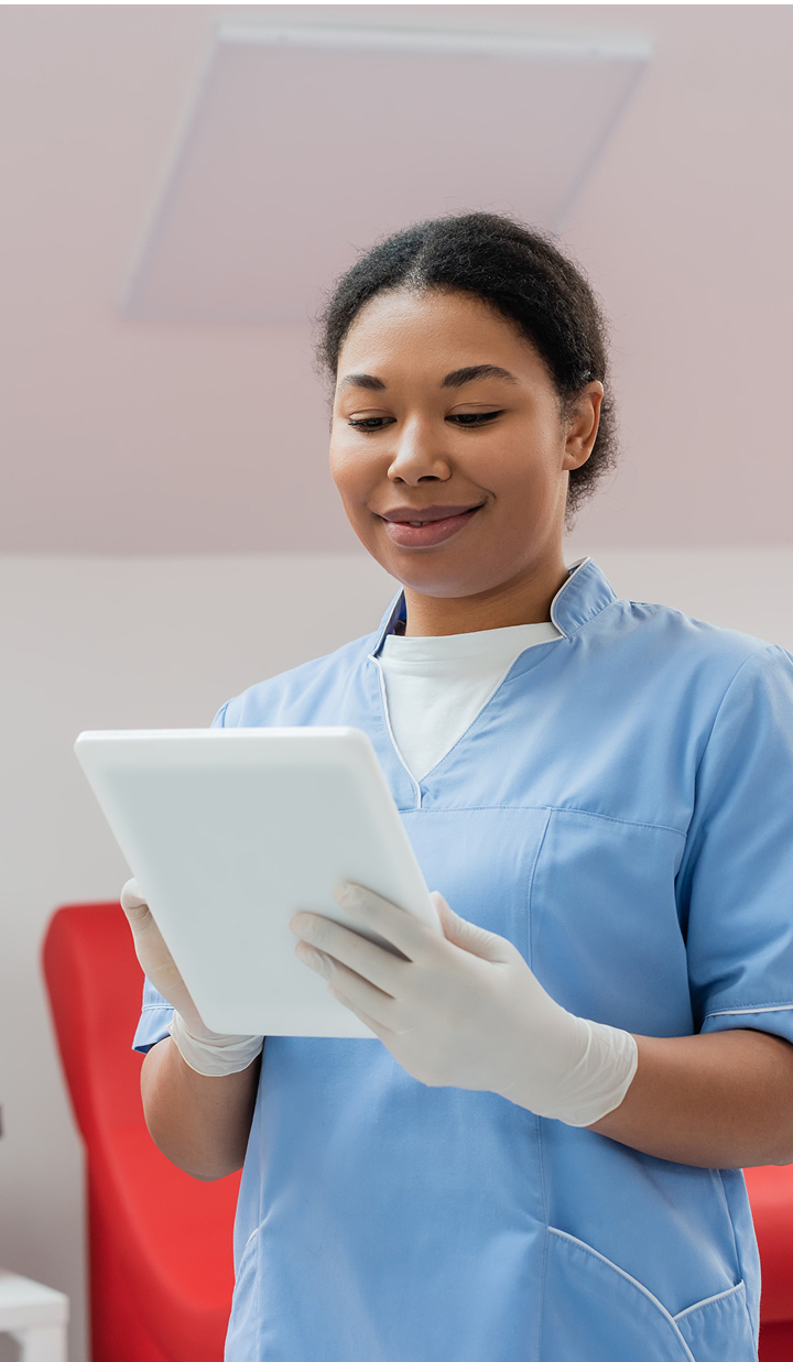Nurse in hospital on ipad