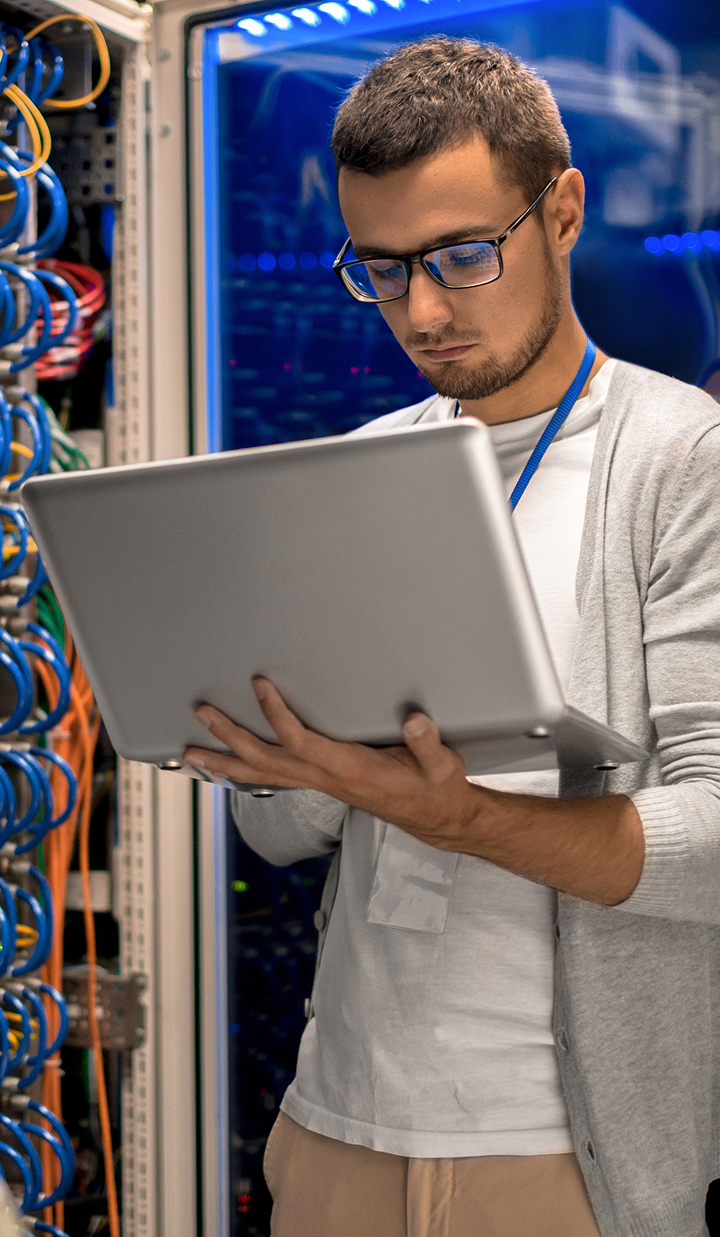 IT specialist working on laptop