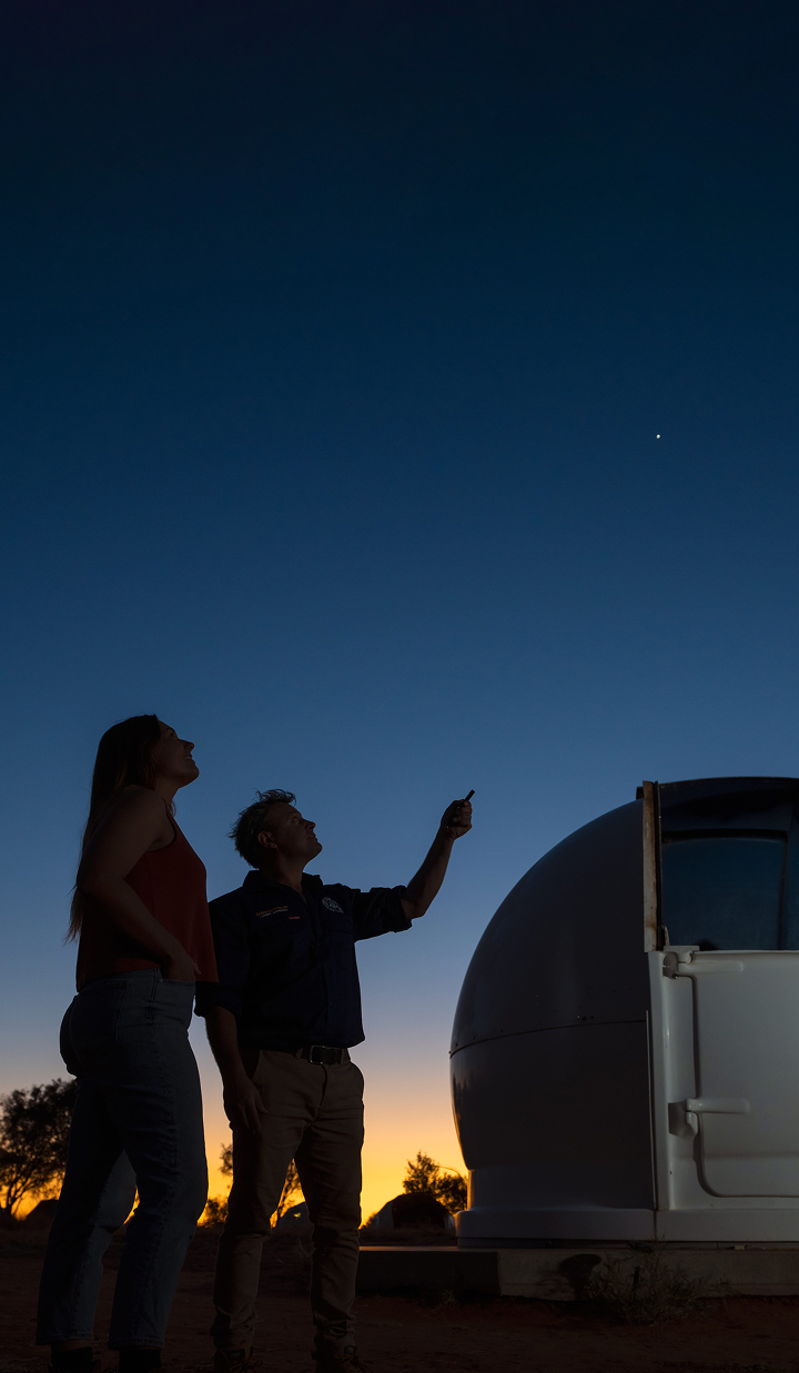 Stargazing at Earth Sanctuary Observatory under a dark sky, with East MacDonnell Ranges in the background