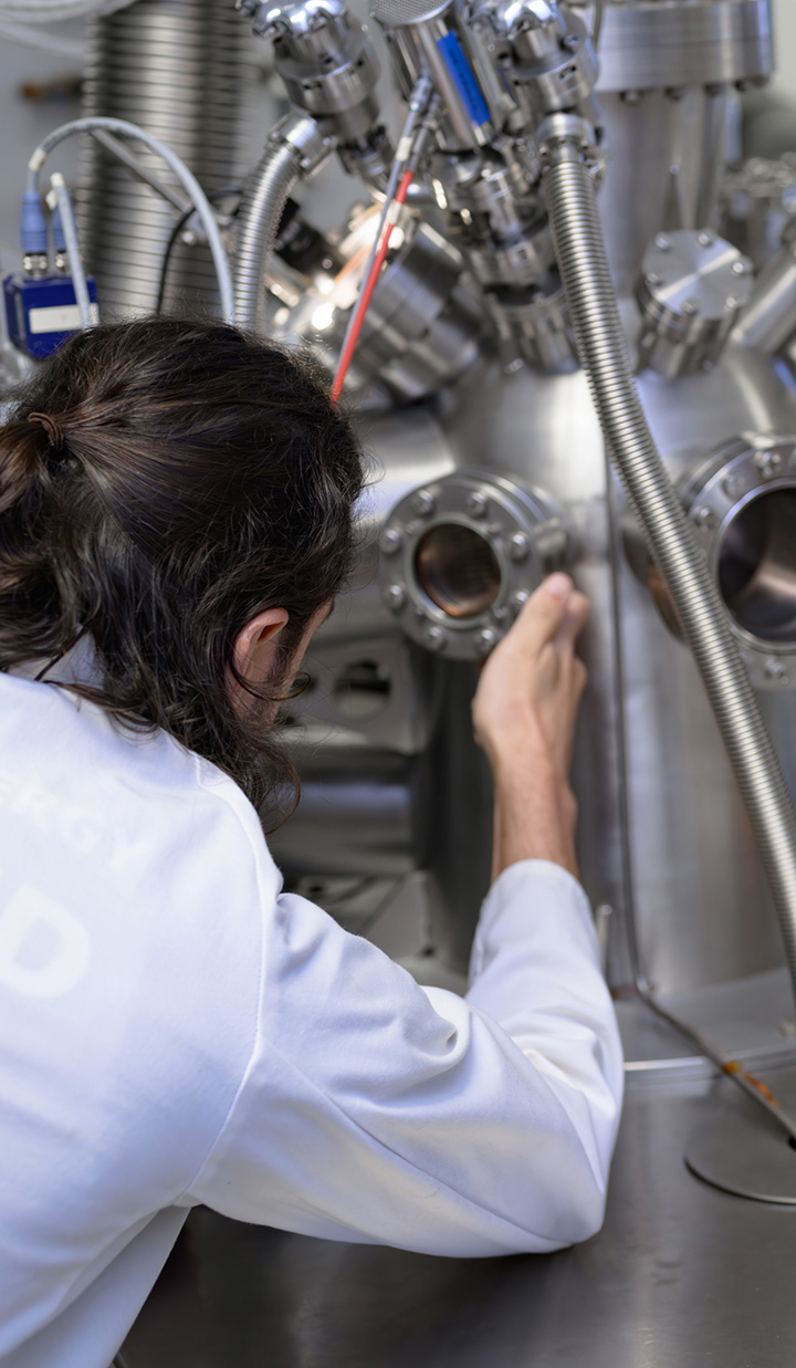 scientist working metal lab instrument