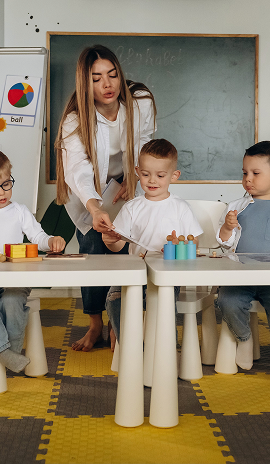 Children learning new words with teacher in kindy