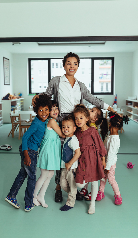 Smiles at kindergarten with teacher and children