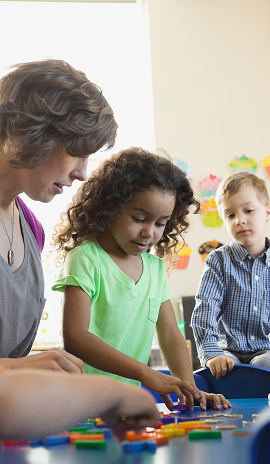 Teacher and students reviewing the alphabet