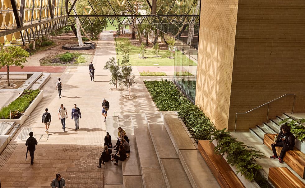 Exterior shot of the University of Western Australia campus with students walking around