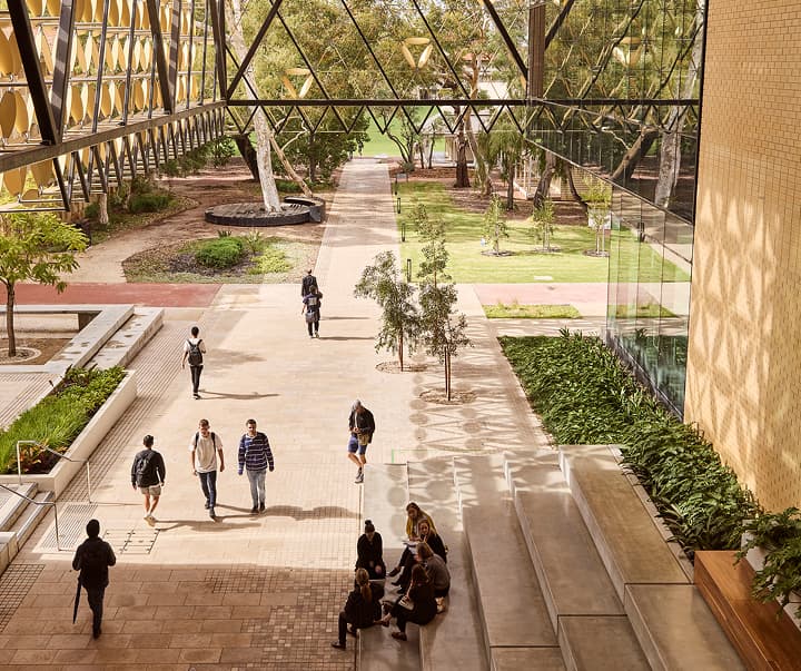 Exterior shot of the University of Western Australia campus with students walking around