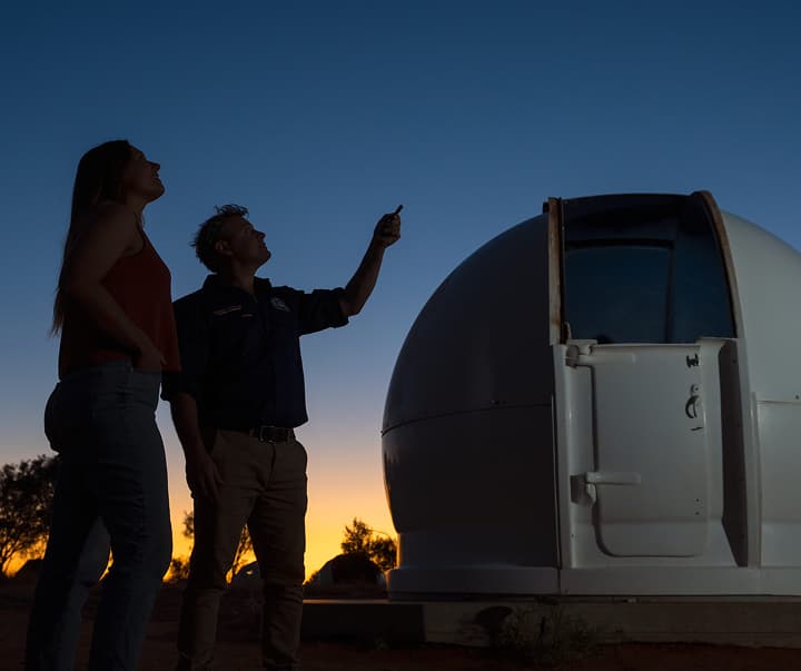 Stargazing at Earth Sanctuary Observatory under a dark sky, with East MacDonnell Ranges in the background