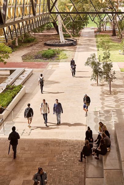 Exterior shot of the University of Western Australia campus with students walking around