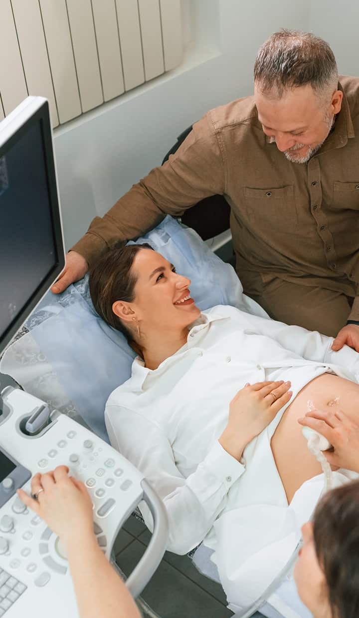 husband supporting pregnant woman