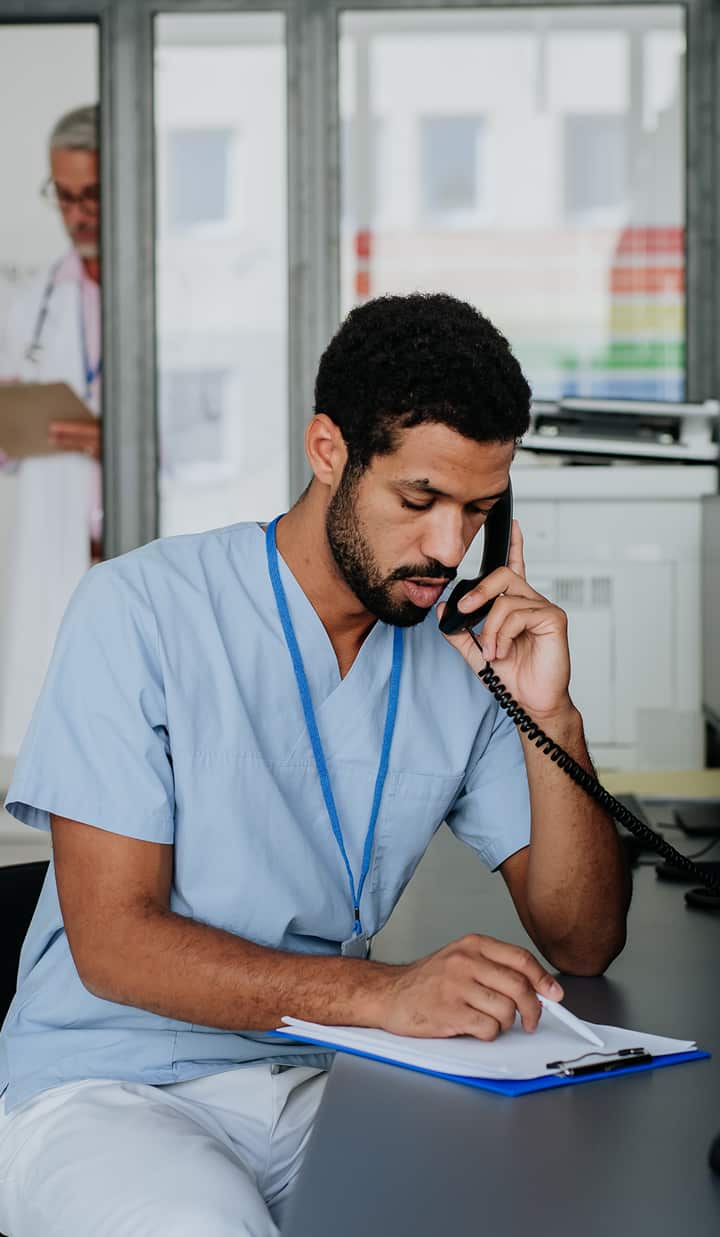 young multiracial doctor sitting at reception