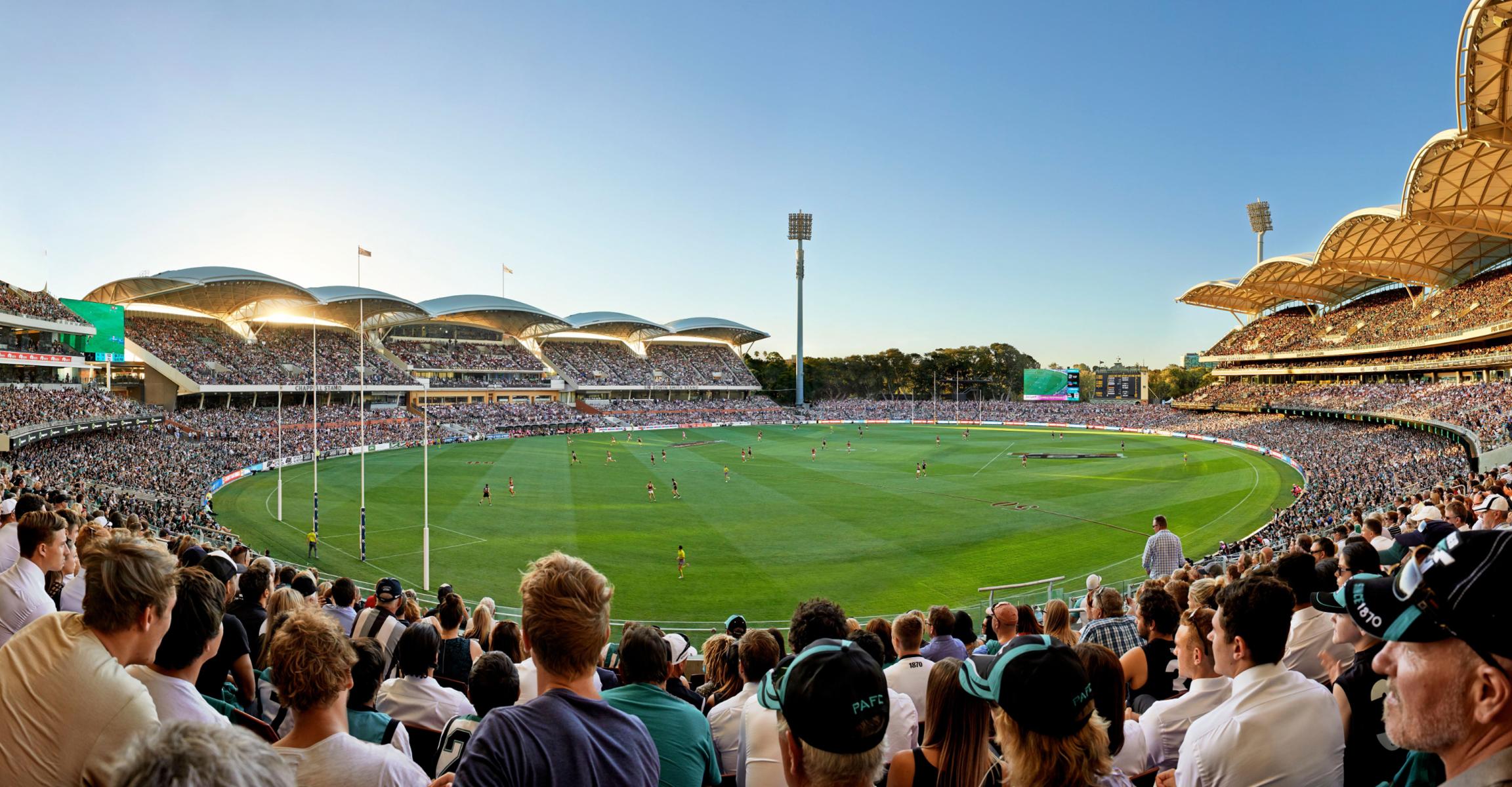 Fans cheering at an AFL match in Adelaide Oval, North Adelaide, South Australia