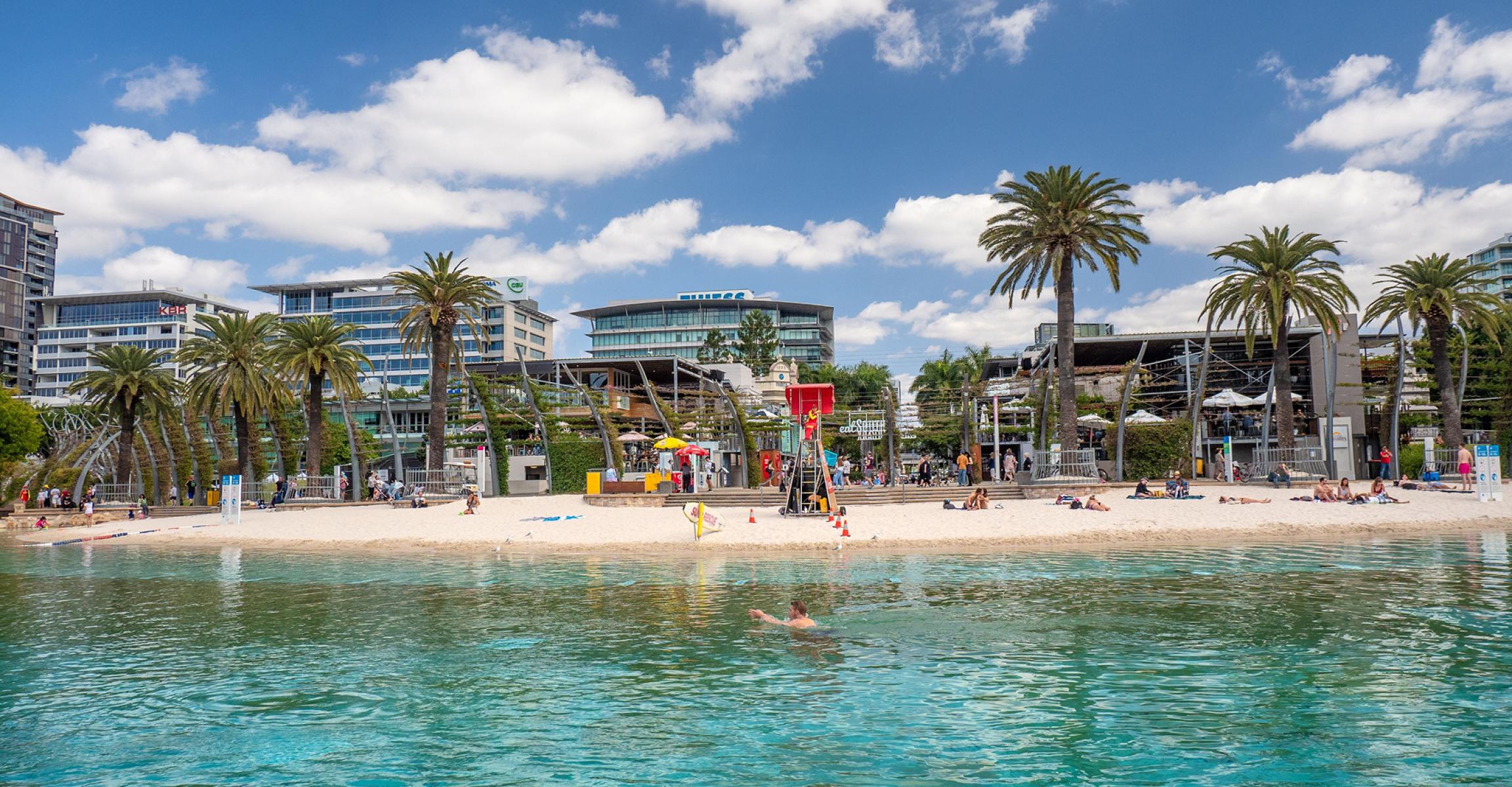 People enjoying the water at Streets Beach in Brisbane’s South Bank.