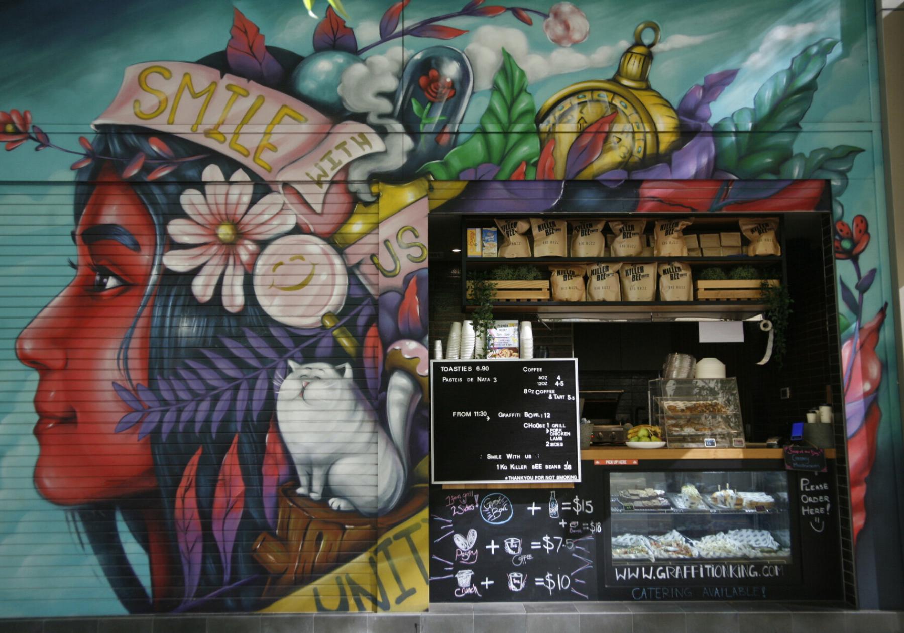 a hole in the wall cafe with graffiti art