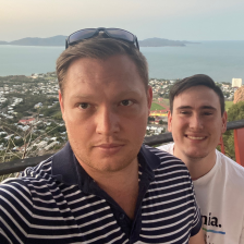 men in front of ocean