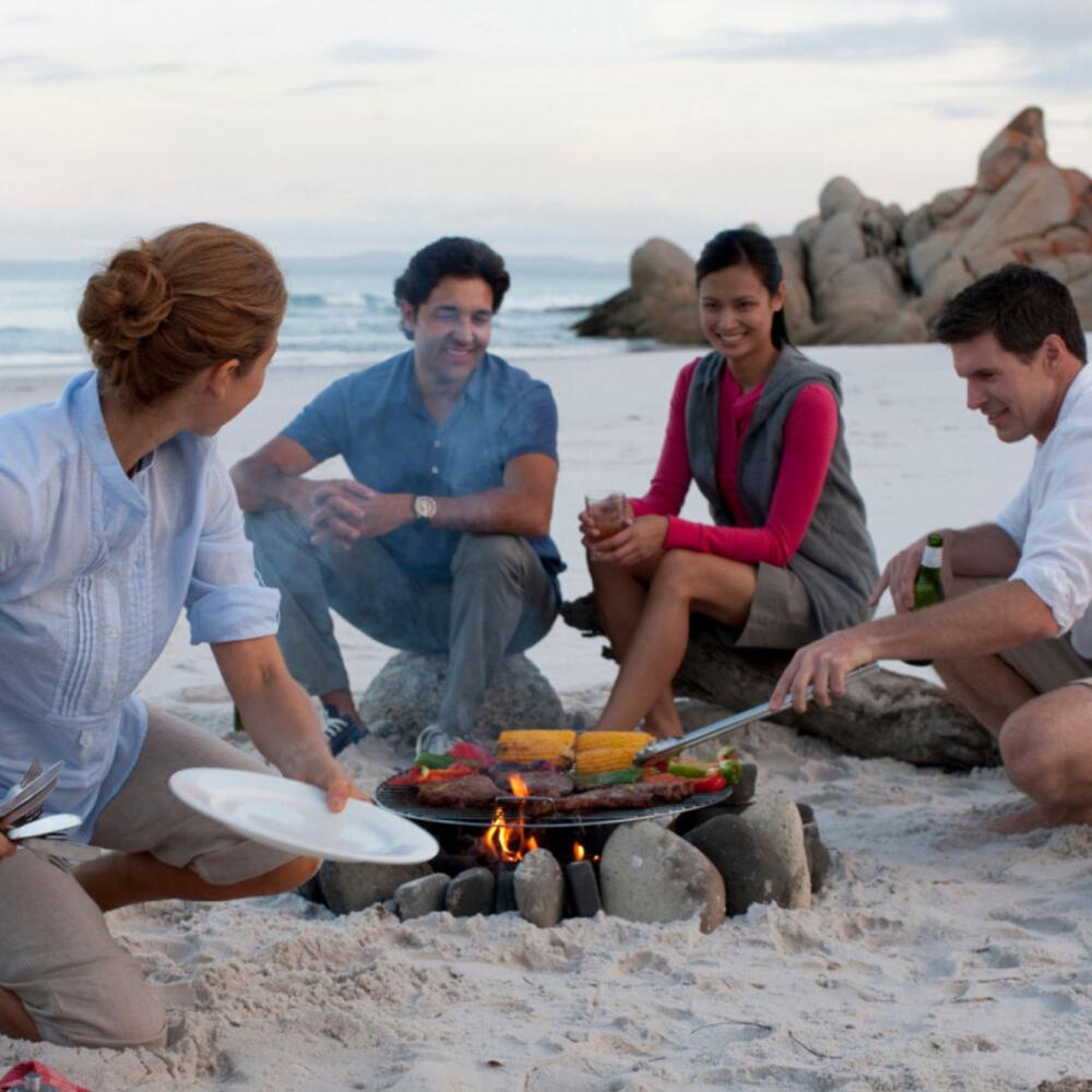having a barbecue on the beach